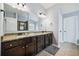 Bathroom featuring double sinks with granite countertops and a large mirror at 1344 Hamilton Creek Nw Dr, Kennesaw, GA 30152