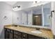 Bathroom with granite countertops, double sinks and a glass shower door at 1344 Hamilton Creek Nw Dr, Kennesaw, GA 30152