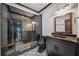 Modern bathroom featuring a glass enclosed shower with black tile and patterned floors at 1344 Hamilton Creek Nw Dr, Kennesaw, GA 30152