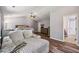 Open Primary bedroom area featuring a daybed, sitting area, ensuite bathroom and hardwood flooring at 1344 Hamilton Creek Nw Dr, Kennesaw, GA 30152