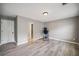 Spacious bedroom with doorway and new flooring that would be perfect for a home gym at 1344 Hamilton Creek Nw Dr, Kennesaw, GA 30152