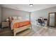Light-filled bedroom with work space, wood floors, and large windows for natural light at 1344 Hamilton Creek Nw Dr, Kennesaw, GA 30152