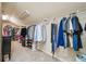 Walk-in closet with rack and shelves for clothing storage at 1344 Hamilton Creek Nw Dr, Kennesaw, GA 30152