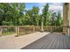 Large deck with wooded backyard view, offering ample space for relaxing and enjoying the outdoors at 1344 Hamilton Creek Nw Dr, Kennesaw, GA 30152