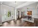 Formal dining room with coffered ceilings, wainscoting, and elegant hardwood floors at 1344 Hamilton Creek Nw Dr, Kennesaw, GA 30152
