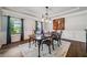 Dining room with hardwood floors and wainscoting, with a chandelier at 1344 Hamilton Creek Nw Dr, Kennesaw, GA 30152