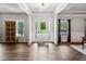 Bright foyer with hardwood floors, white trim, and a glass-paneled front door at 1344 Hamilton Creek Nw Dr, Kennesaw, GA 30152