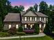Charming two-story home with stone accents, a covered porch, and well-maintained landscaping at 1344 Hamilton Creek Nw Dr, Kennesaw, GA 30152