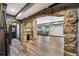 Inviting living area featuring stone archways, hardwood floors, and ample space for relaxing and entertaining guests at 1344 Hamilton Creek Nw Dr, Kennesaw, GA 30152