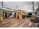 Spacious living area with stone accents, hardwood floors, and comfortable seating, perfect for relaxation and entertainment at 1344 Hamilton Creek Nw Dr, Kennesaw, GA 30152