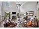 Spacious living room with hardwood floors, fireplace, high ceilings, and seamless kitchen access at 1344 Hamilton Creek Nw Dr, Kennesaw, GA 30152