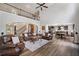 Open floor plan showcases living room, kitchen, and dining area with hardwood floors and high ceilings at 1344 Hamilton Creek Nw Dr, Kennesaw, GA 30152