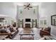Spacious living room with hardwood floors, fireplace, high ceilings, and seamless kitchen access at 1344 Hamilton Creek Nw Dr, Kennesaw, GA 30152