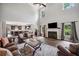 Spacious living room with hardwood floors, fireplace, high ceilings, and seamless kitchen access at 1344 Hamilton Creek Nw Dr, Kennesaw, GA 30152
