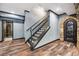 A home interior staircase with a stone cellar door and tile mosaic bathroom at 1344 Hamilton Creek Nw Dr, Kennesaw, GA 30152
