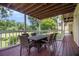 Spacious covered back deck with outdoor furniture for dining and relaxation at 1452 Crooked Tree Cir, Stone Mountain, GA 30088
