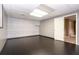 View of the finished basement with dark flooring and neutral-toned walls at 1452 Crooked Tree Cir, Stone Mountain, GA 30088