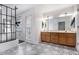 Elegant bathroom with a dual-sink vanity, black and white tile floor, and a glass shower at 1452 Crooked Tree Cir, Stone Mountain, GA 30088