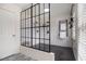 Modern bathroom featuring a sleek glass shower with black trim and subway tile at 1452 Crooked Tree Cir, Stone Mountain, GA 30088