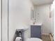 Cozy bathroom features a corner sink, toilet, and shower with curtain at 1452 Crooked Tree Cir, Stone Mountain, GA 30088