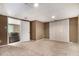 Bedroom featuring neutral carpet, bi-fold closet doors and view into Gathering room at 1452 Crooked Tree Cir, Stone Mountain, GA 30088