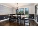 Charming dining room featuring natural lighting, hardwood floors, and a long table at 1452 Crooked Tree Cir, Stone Mountain, GA 30088