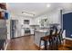 Modern kitchen featuring stainless steel appliances, white cabinets, and hardwood floors at 1452 Crooked Tree Cir, Stone Mountain, GA 30088