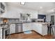 Bright kitchen with white cabinets, stainless steel appliances, and granite countertops at 1452 Crooked Tree Cir, Stone Mountain, GA 30088