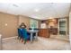 Open kitchen area with a dining table, bright blue chairs and lots of natural light at 1452 Crooked Tree Cir, Stone Mountain, GA 30088