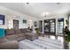 Spacious living room with hardwood floors, large windows, and comfortable seating at 1452 Crooked Tree Cir, Stone Mountain, GA 30088