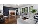 Inviting living room with hardwood floors, a brick fireplace, and french doors at 1452 Crooked Tree Cir, Stone Mountain, GA 30088