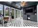 Stylish living room with dark walls, built-in shelving, and lots of natural light at 1452 Crooked Tree Cir, Stone Mountain, GA 30088
