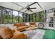 Relaxing sunroom with comfortable seating and a view of the lush greenery outside at 1452 Crooked Tree Cir, Stone Mountain, GA 30088