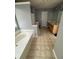 Spacious bathroom with a soaking tub, dual sinks, and tile flooring at 443 Marsh Lake Rd, Lawrenceville, GA 30045