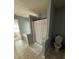 Bathroom area featuring a walk-in shower, toilet, and bathtub at 443 Marsh Lake Rd, Lawrenceville, GA 30045