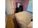 Bedroom with large bed, dresser with mirror, and natural light at 443 Marsh Lake Rd, Lawrenceville, GA 30045