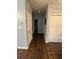 Hallway with dark floors, light blue walls and with views into the bathroom and bedroom at 443 Marsh Lake Rd, Lawrenceville, GA 30045