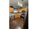 Modern kitchen featuring stainless steel appliances, wood cabinets, and a window over the sink at 443 Marsh Lake Rd, Lawrenceville, GA 30045