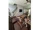 Comfortable living room featuring a ceiling fan, television, staircase, and a unique patterned rug at 443 Marsh Lake Rd, Lawrenceville, GA 30045
