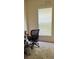 Bright office space with office chair, desk, and natural light at 443 Marsh Lake Rd, Lawrenceville, GA 30045