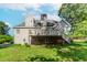 Lawn featuring a house with a deck at 1100 Midland Way, Lawrenceville, GA 30043