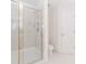 Bathroom showcases a glass shower, toilet, and white tile flooring at 1100 Midland Way, Lawrenceville, GA 30043