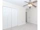 Bedroom features a ceiling fan, a closet and ample natural light at 1100 Midland Way, Lawrenceville, GA 30043