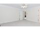 Bedroom featuring neutral carpet, fan, and windows for great light at 1100 Midland Way, Lawrenceville, GA 30043