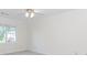Bedroom with neutral walls, ceiling fan and large window at 1100 Midland Way, Lawrenceville, GA 30043