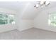 Bedroom with neutral walls, angled ceiling and two large windows at 1100 Midland Way, Lawrenceville, GA 30043