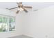 Bright bedroom featuring a ceiling fan and large window at 1100 Midland Way, Lawrenceville, GA 30043