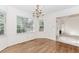 Charming dining room with hardwood floors, large windows, and a chandelier at 1100 Midland Way, Lawrenceville, GA 30043