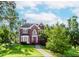 Inviting brick home with a red front door, bay window, and manicured lawn at 1100 Midland Way, Lawrenceville, GA 30043