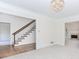 Inviting living room with staircase, fireplace, and adjacent rooms at 1100 Midland Way, Lawrenceville, GA 30043